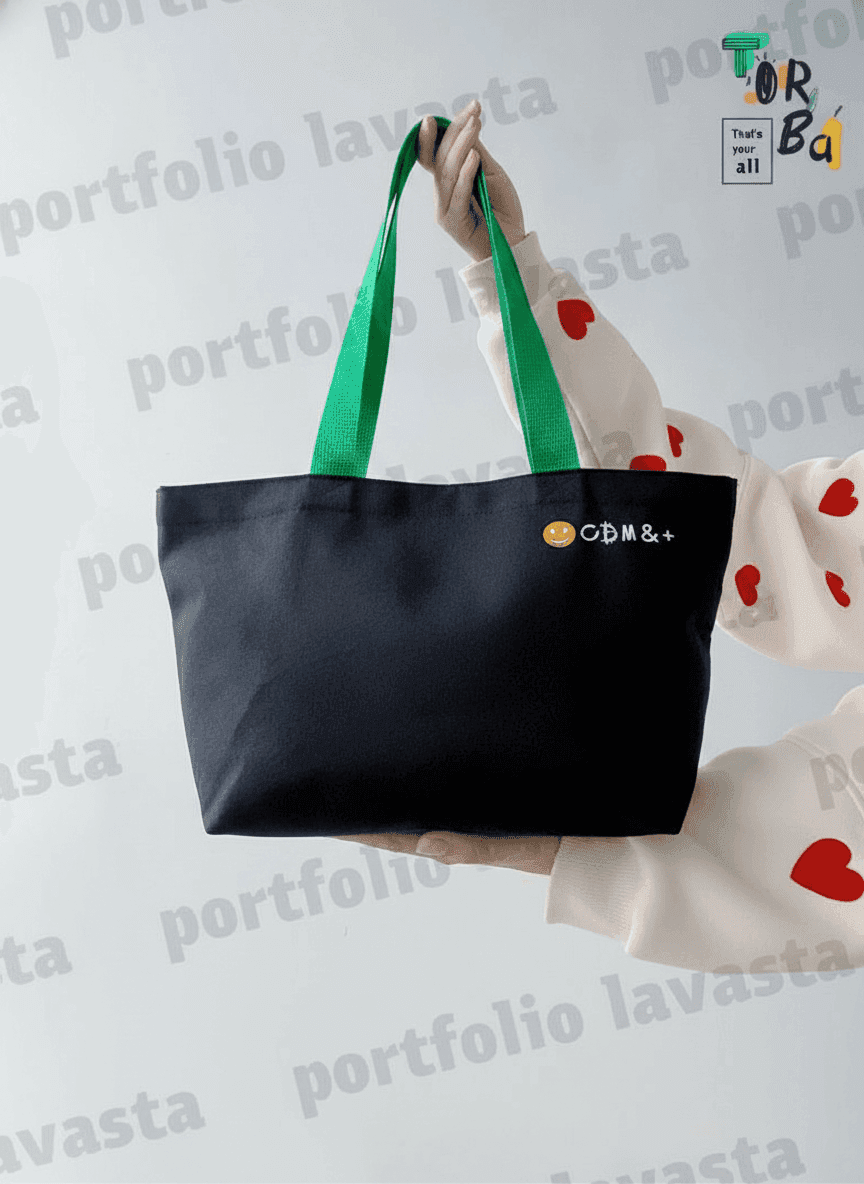 Black cotton twill tote with green handles