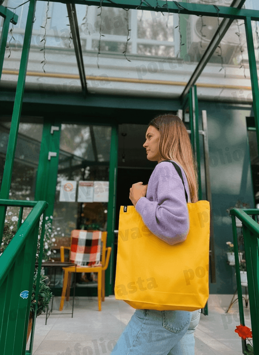 Yellow tote bag with black handles & exterior pocket