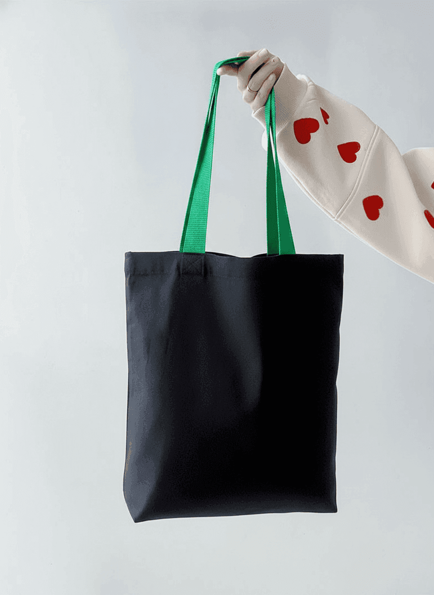 Black cotton twill tote with green handles