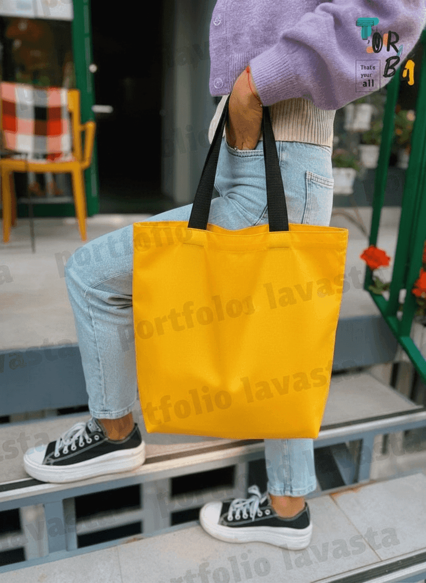 Yellow tote bag with black handles & exterior pocket
