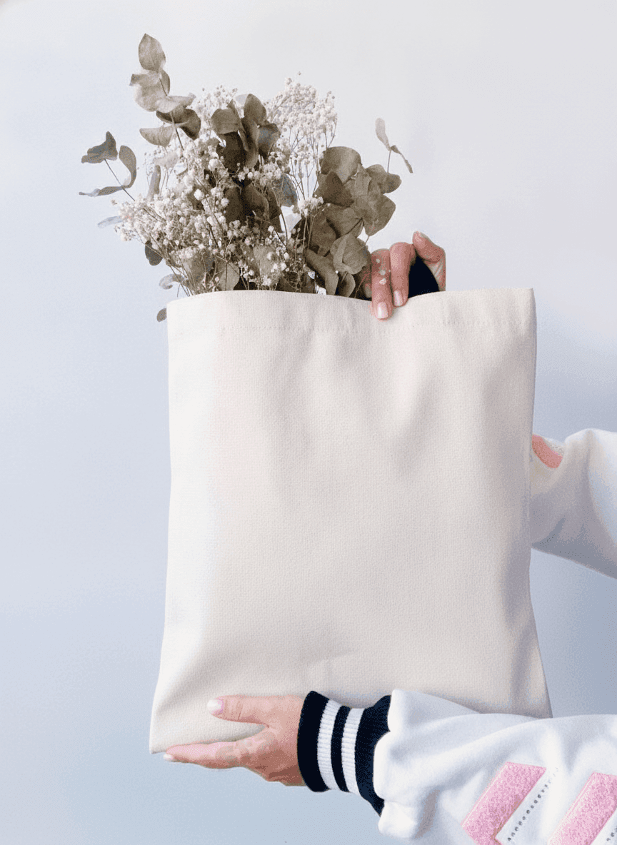 Natural canvas tote bag with black handles