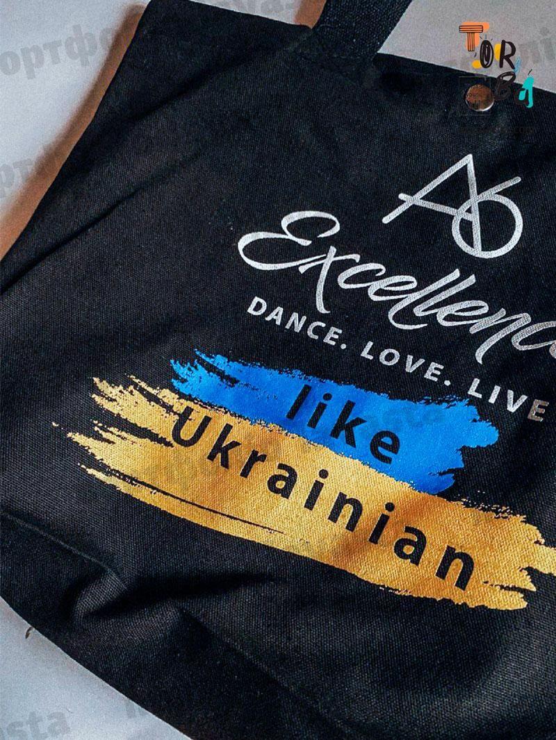Сумка з дном із чорної двонитки з кнопкою і організованим внутрішнім простором без друку