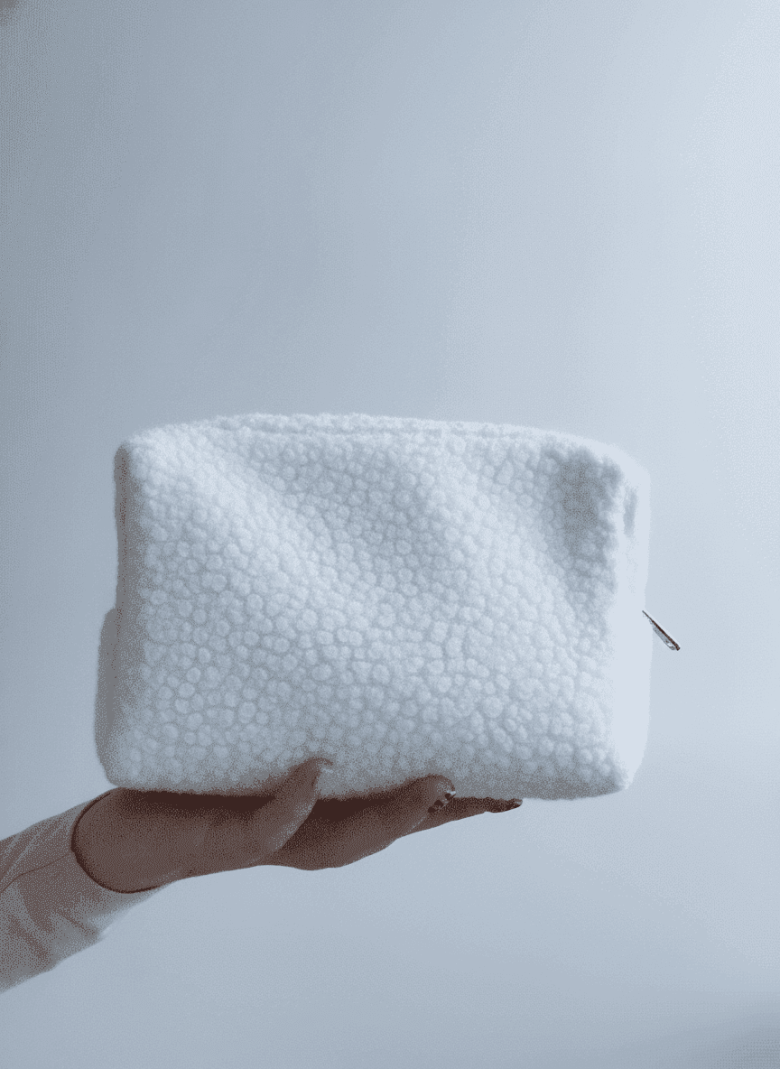 Compact shearling makeup bag with gold zipper
