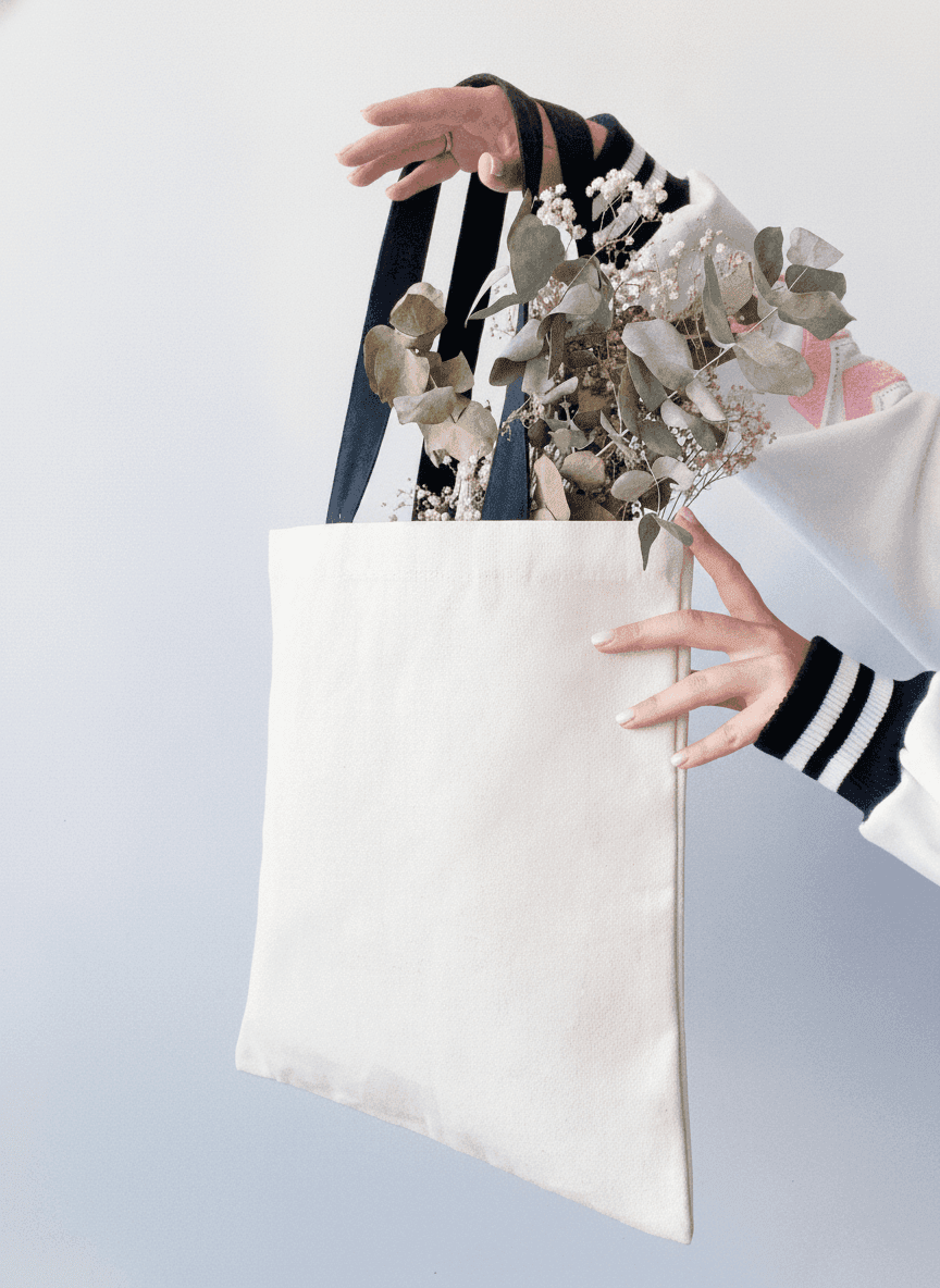Natural canvas tote bag with black handles