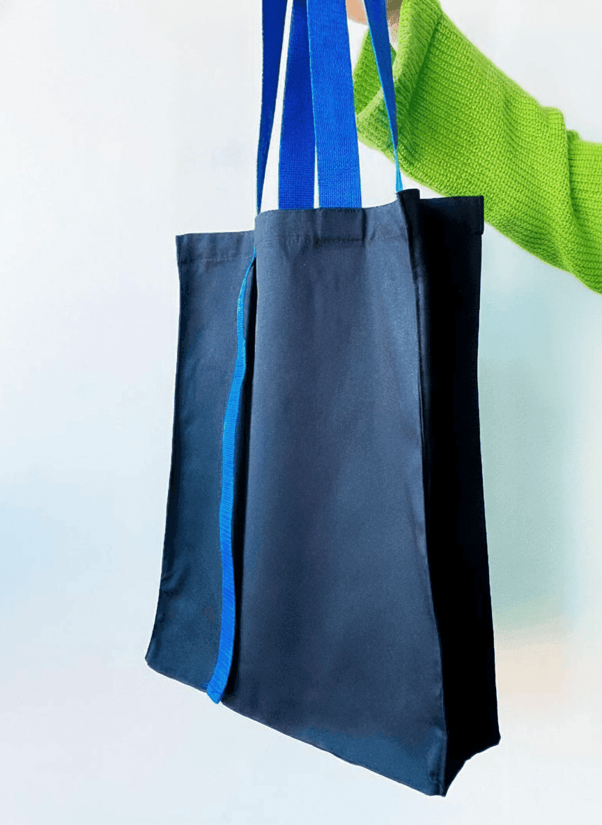 Oversized tote with long blue handle