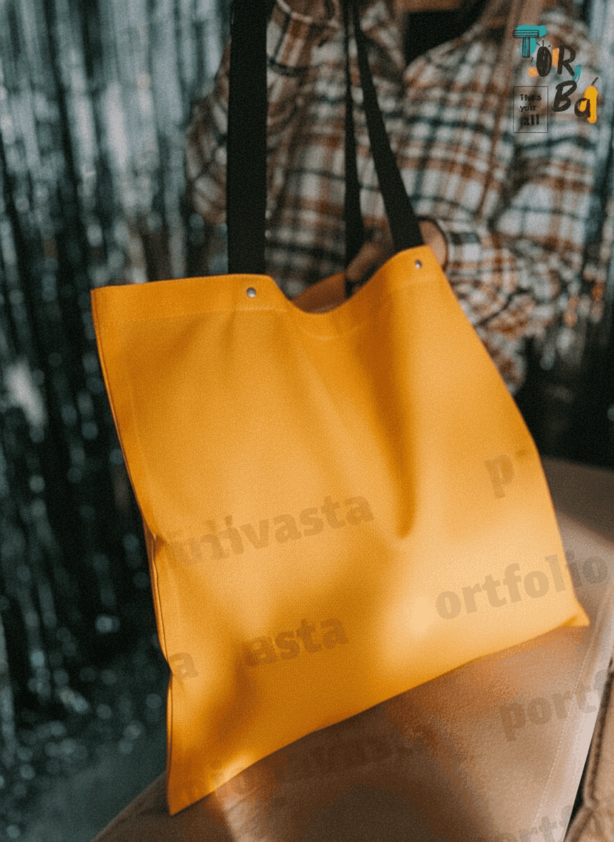 Orange tote bag with rivet handles
