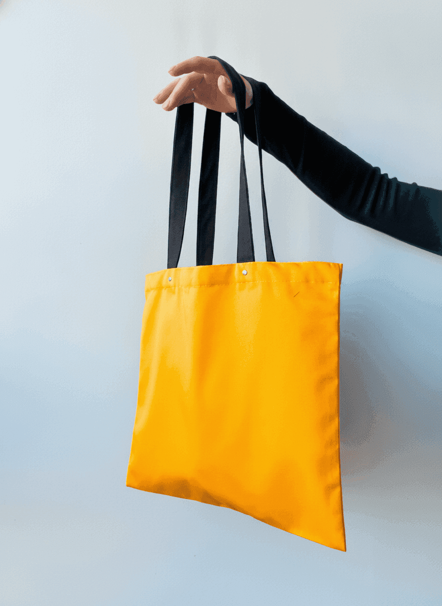 Orange tote bag with rivet handles